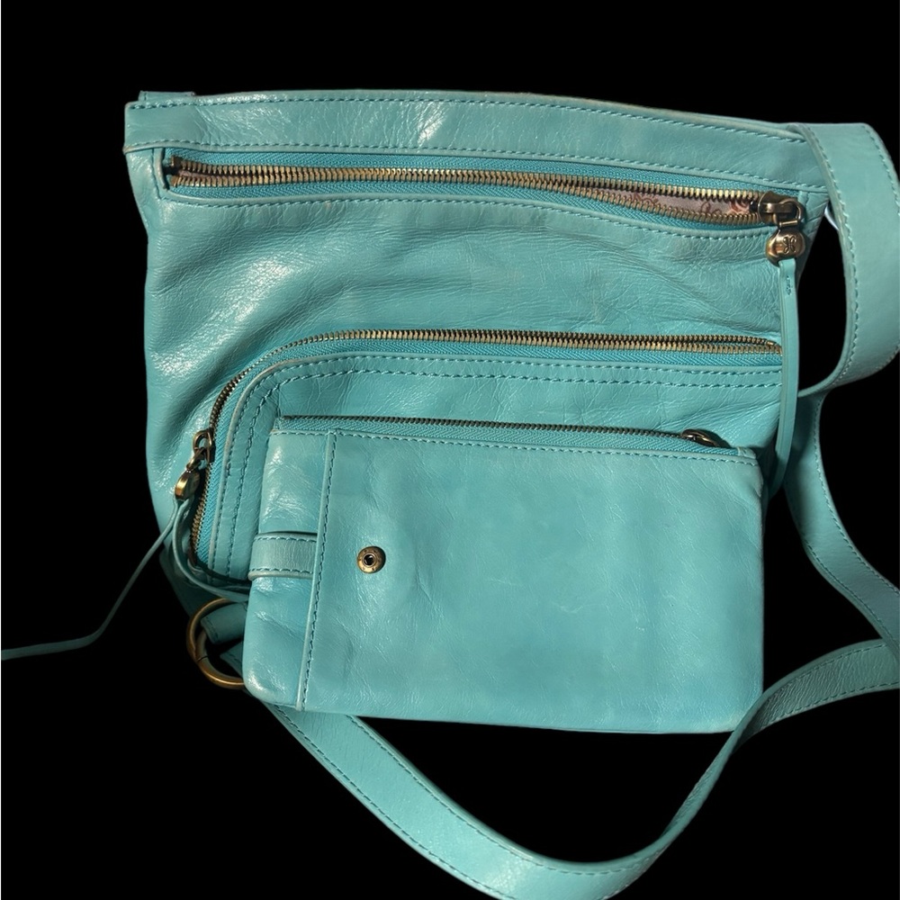 Soft, beautiful blue leather purse and wallet. A little worn on the bottom.